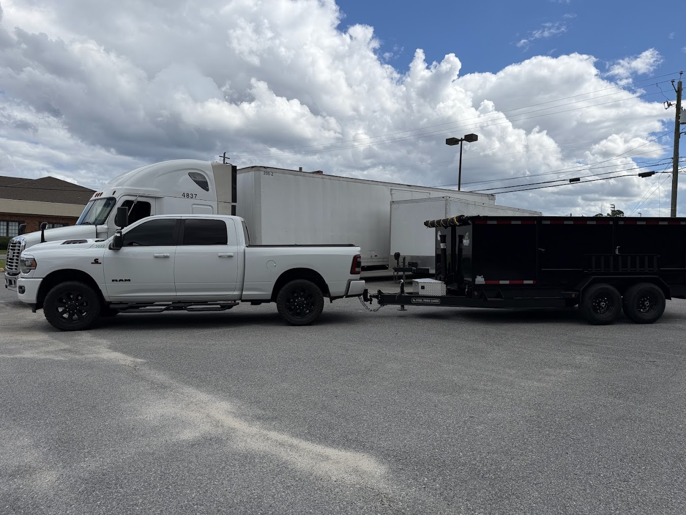 Our dump trailer with delivery truck